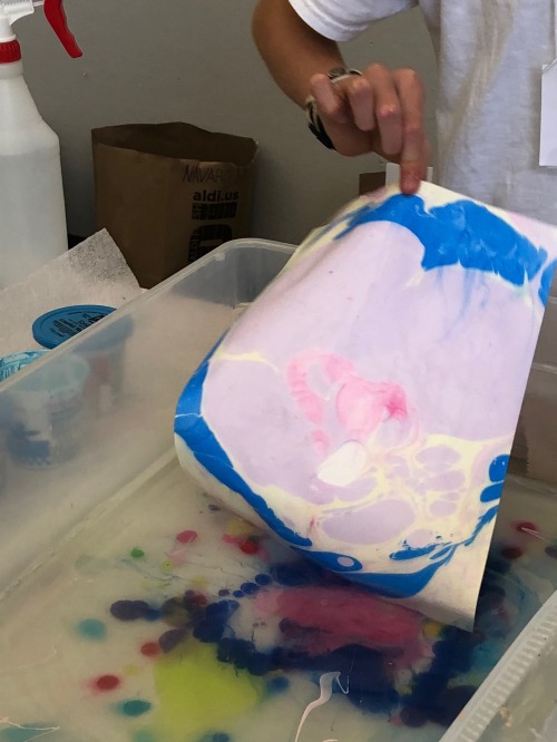 color grabs paper after floating in colors